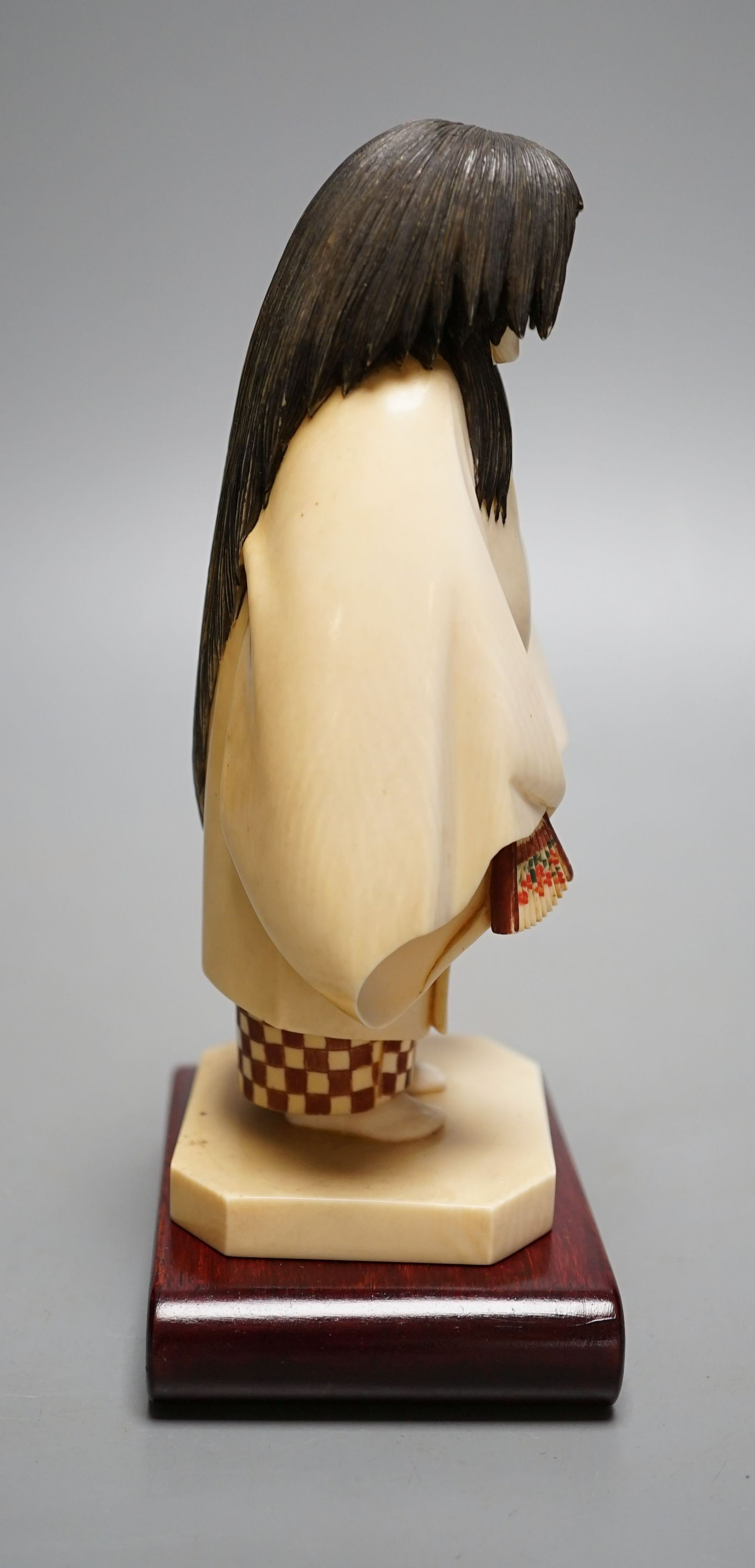 A Japanese ivory figure of a priest, Taisho/early Showa period, signed to a lacquer tablet - 17cm tall